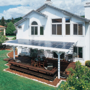 Home with solar panels on porch awning