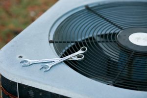 outdoor-ac-unit-with-tools-on-top