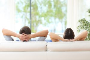 couple-relaxing-on-couch