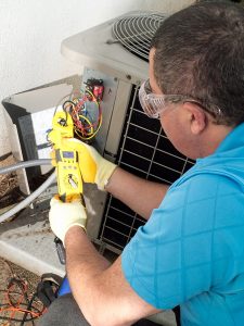 hvac-technician-making-ac-repairs