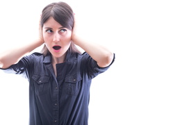 woman-covering-ears-on-white-background