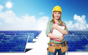 female-construction-worker-standing-by-rows-of-solar-panels