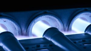 Blue furnace flames burning steadily, representing a well-functioning system after furnace maintenance service.