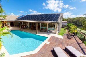 solar-panels-on-roof-with-pool-in-foreground