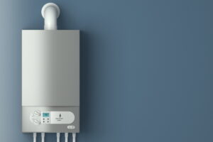 Tankless water heater system installed on wall.